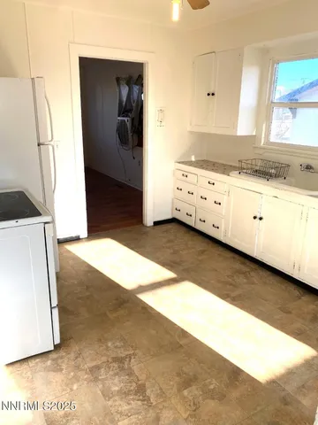 a view of a kitchen with a sink