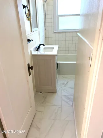 a bathroom with a sink and a bathtub