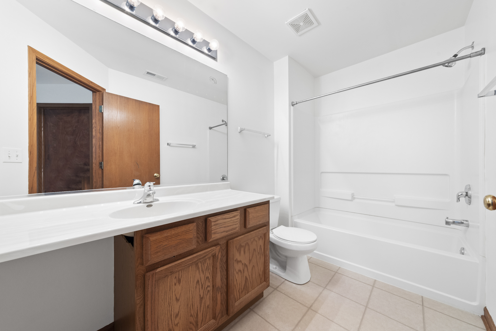278 South Oak Creek Lane Romeoville, IL 60446 - Photo 13 of 16 a bathroom with a sink a toilet and shower