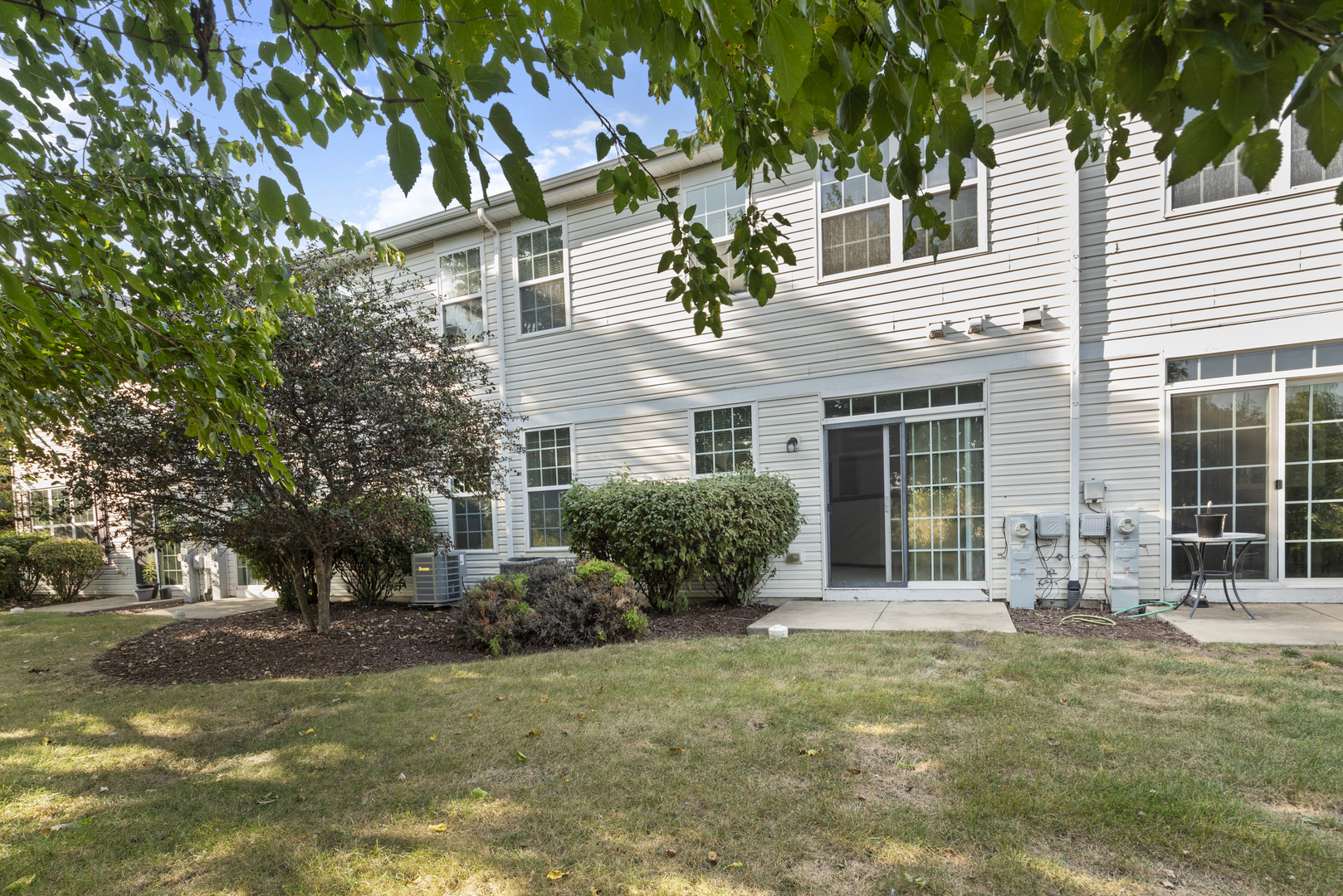 278 South Oak Creek Lane Romeoville, IL 60446 - Photo 16 of 16 a front view of a house with garden