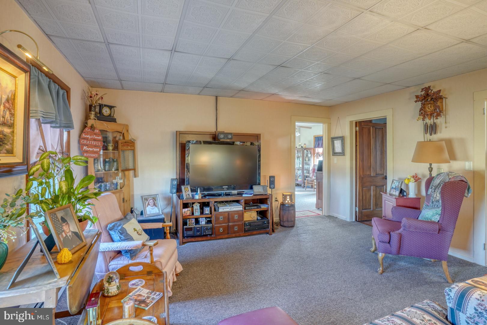 20730 Bucks Branch Road Seaford, DE 19973 - Photo 41 of 64 a living room with furniture and a flat screen tv