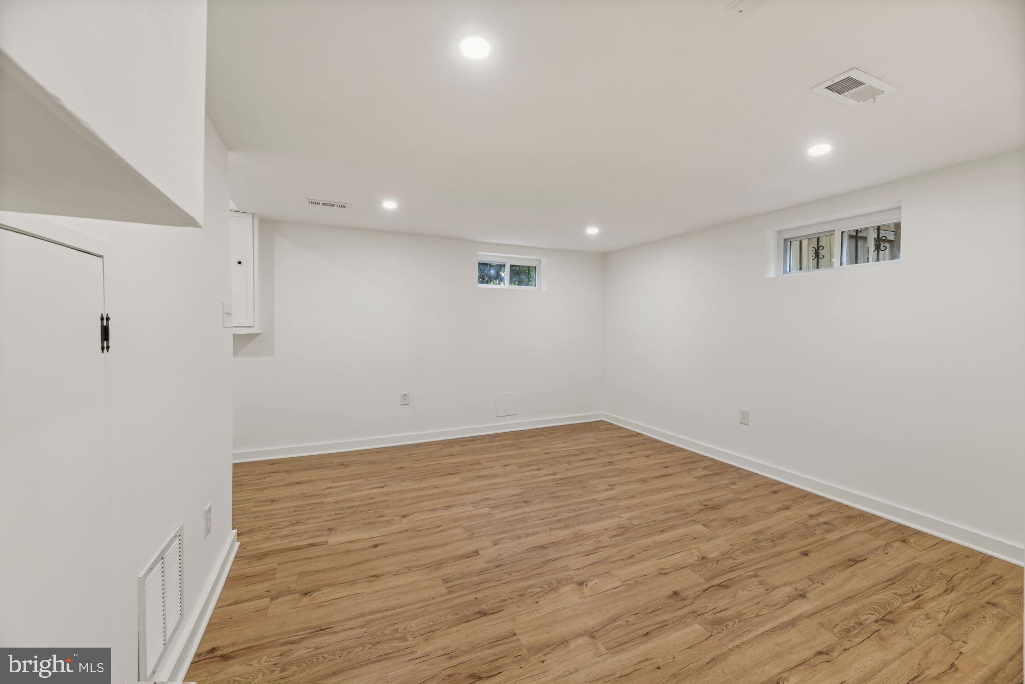1530 Howard Road Southeast Washington, DC 20020 - Photo 22 of 32 a view of empty room with wooden floor