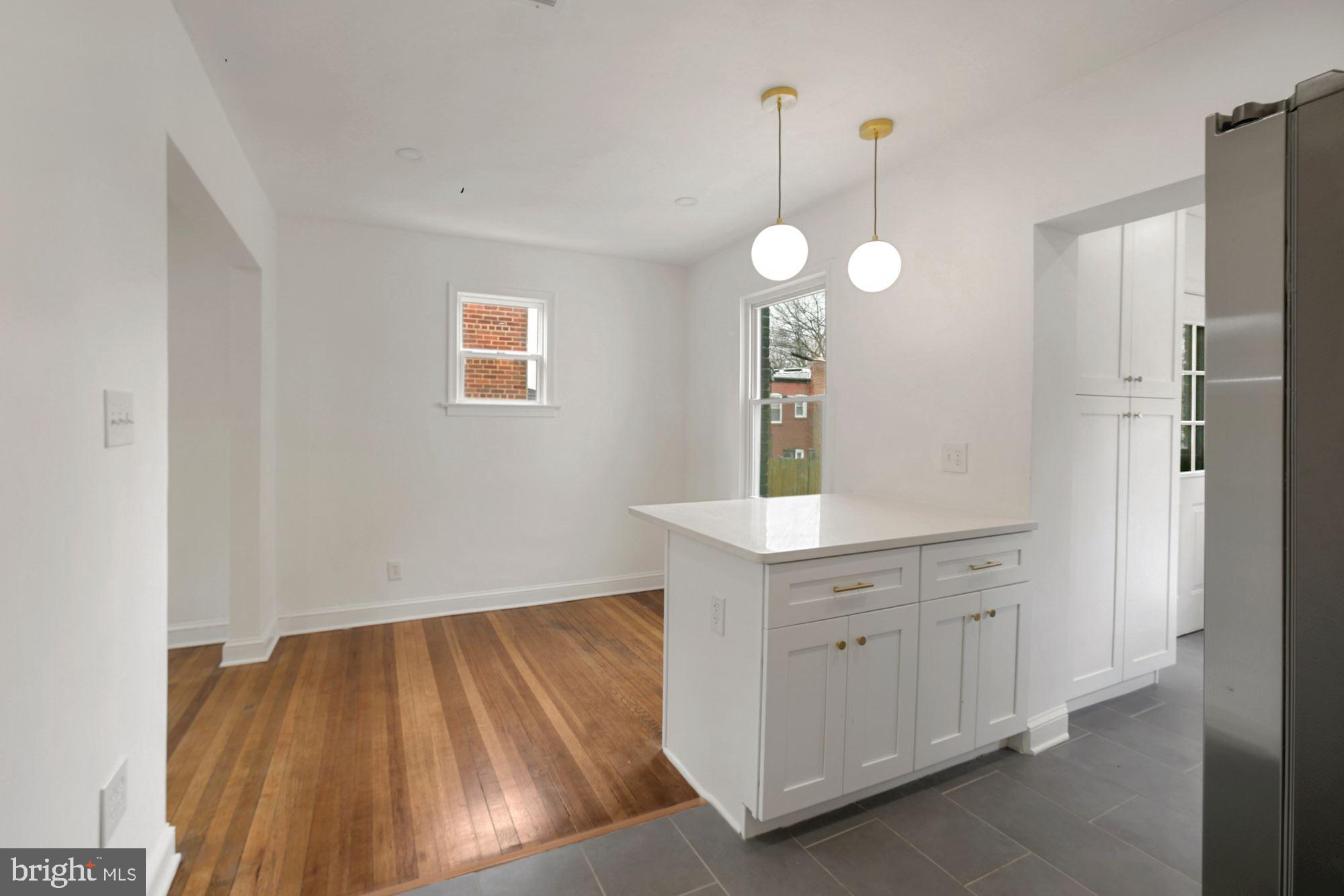 1530 Howard Road Southeast Washington, DC 20020 - Photo 7 of 32 a view of a room with cabinets and wooden floor