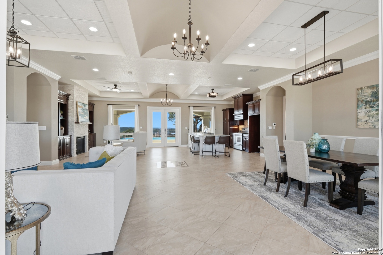 1030 Mystic Parkway Spring Branch, TX 78070 - Photo 11 of 63 a view of a dining room and livingroom with furniture wooden floor a chandelier