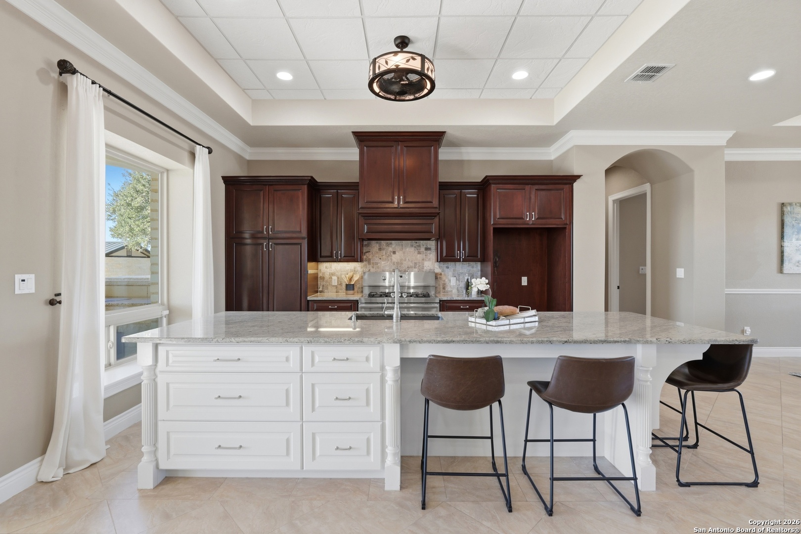 1030 Mystic Parkway Spring Branch, TX 78070 - Photo 12 of 63 a kitchen with granite countertop cabinets and chairs