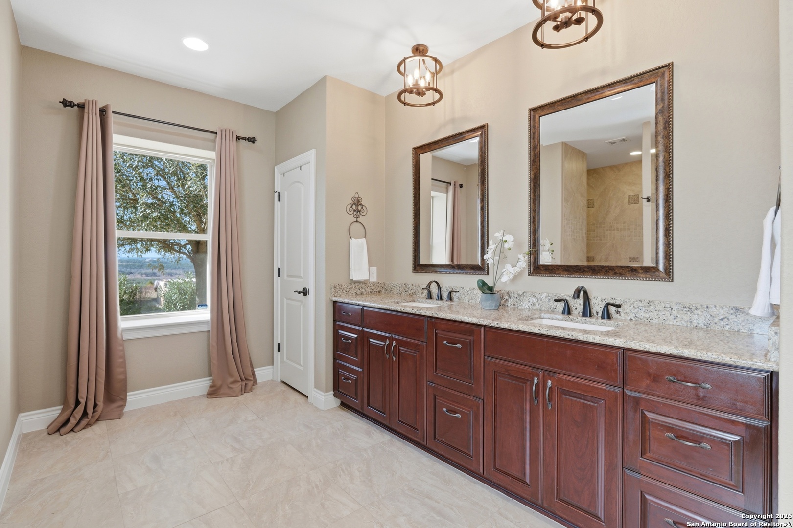 1030 Mystic Parkway Spring Branch, TX 78070 - Photo 25 of 63 a bathroom with a double vanity sink and a mirror
