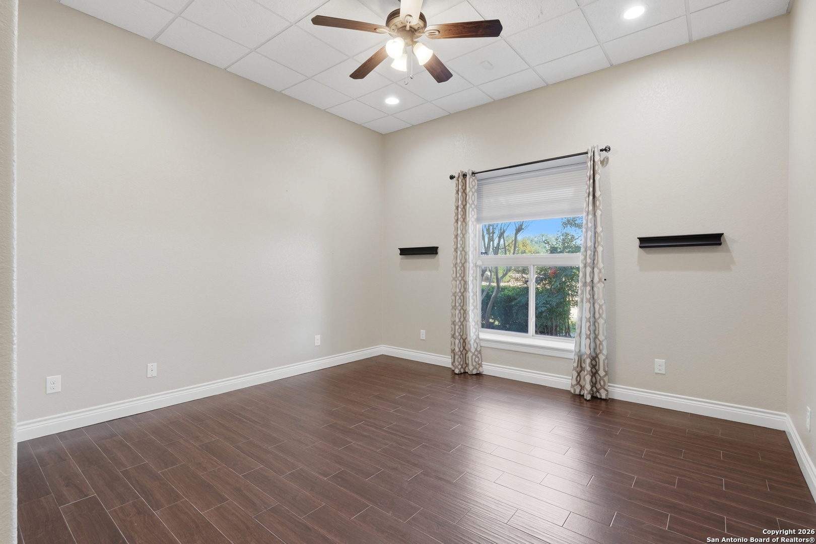 1030 Mystic Parkway Spring Branch, TX 78070 - Photo 28 of 63 an empty room with wooden floor chandelier fan and windows