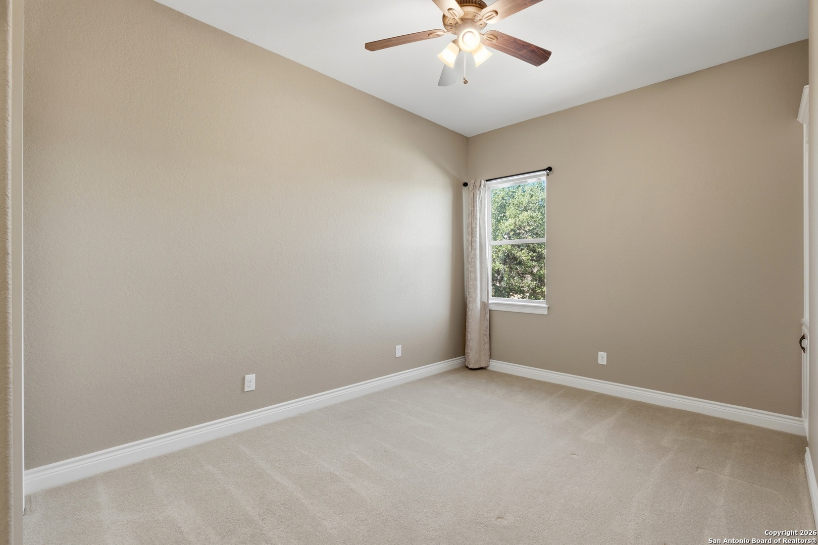 1030 Mystic Parkway Spring Branch, TX 78070 - Photo 37 of 63 an empty room with chandelier fan and windows