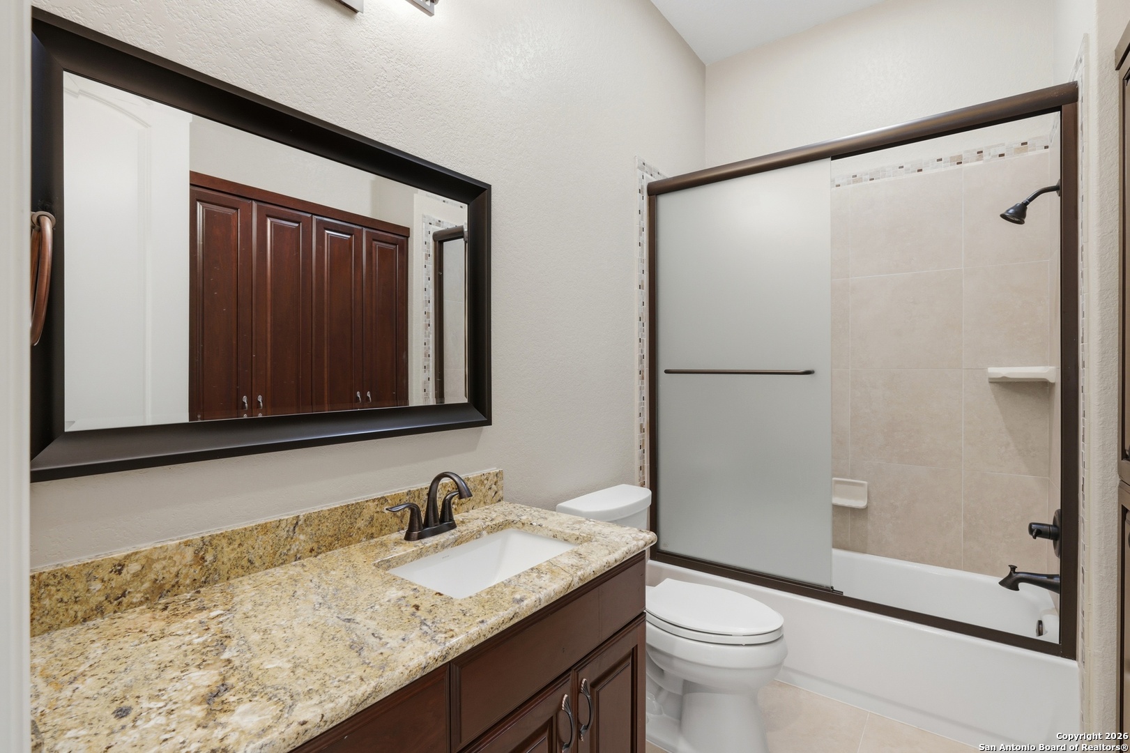 1030 Mystic Parkway Spring Branch, TX 78070 - Photo 38 of 63 a bathroom with a granite countertop sink toilet and shower