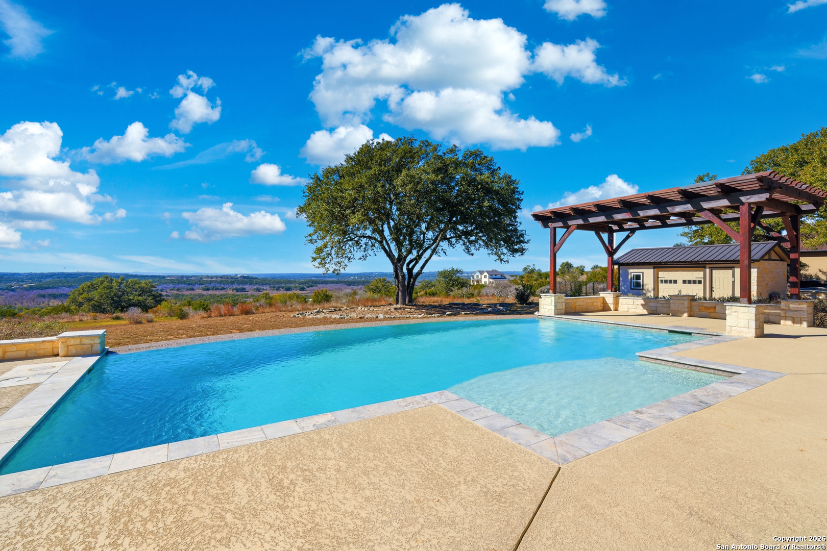 1030 Mystic Parkway Spring Branch, TX 78070 - Photo 45 of 63 a view of a swimming pool with an outdoor seating and a yard