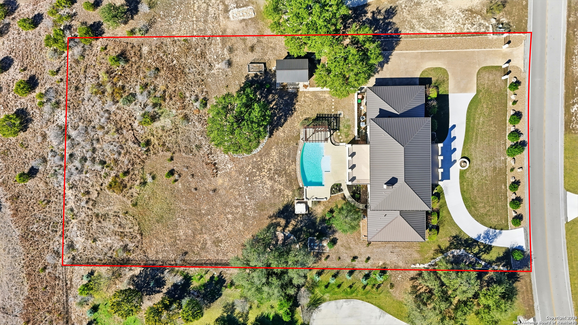 1030 Mystic Parkway Spring Branch, TX 78070 - Photo 10 of 63 a aerial view of a house with a yard and garden in the back