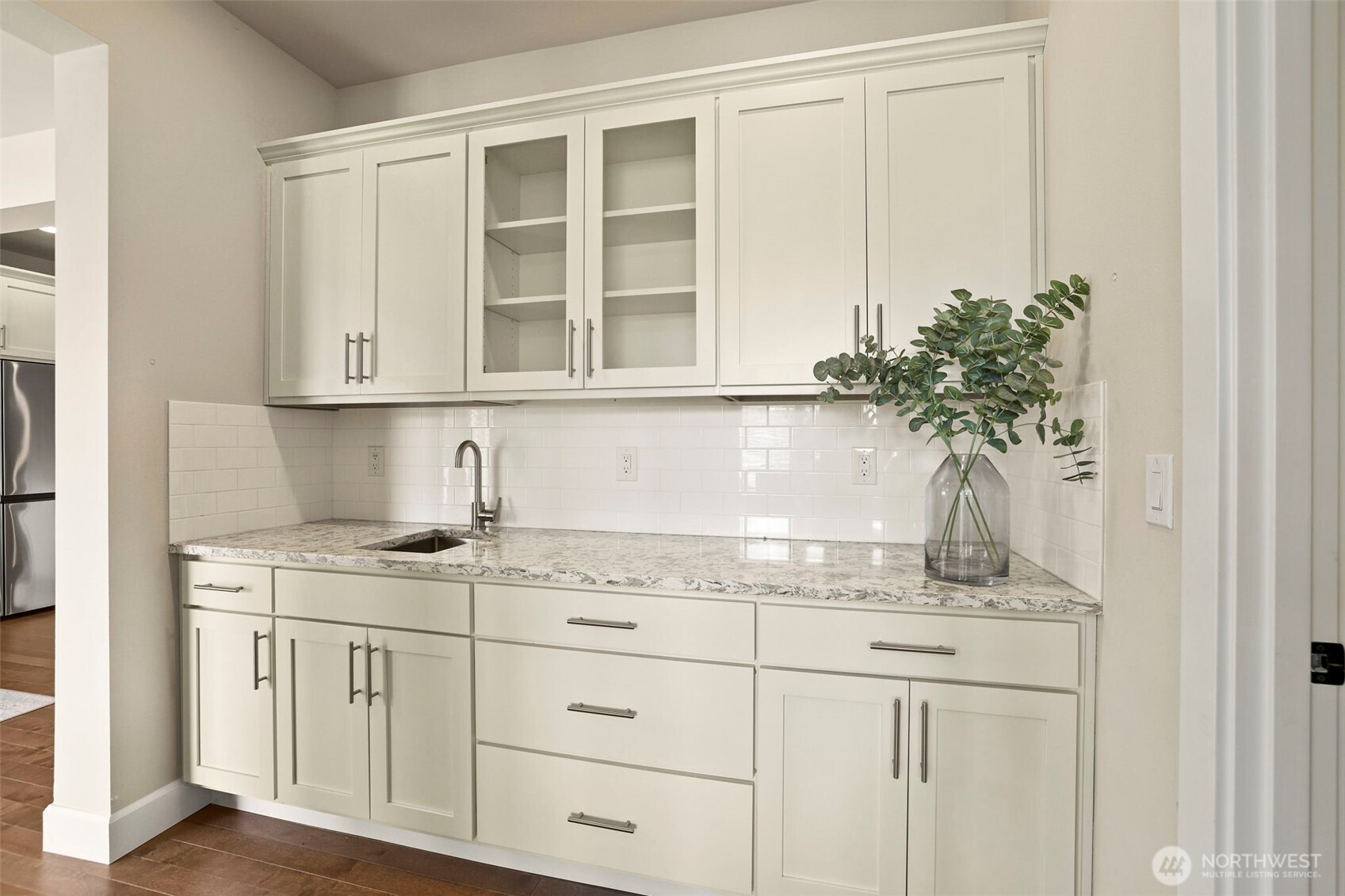 29 242nd Street Southeast Bothell, WA 98021 - Photo 12 of 40 a kitchen with stainless steel appliances granite countertop white cabinets and a potted plant