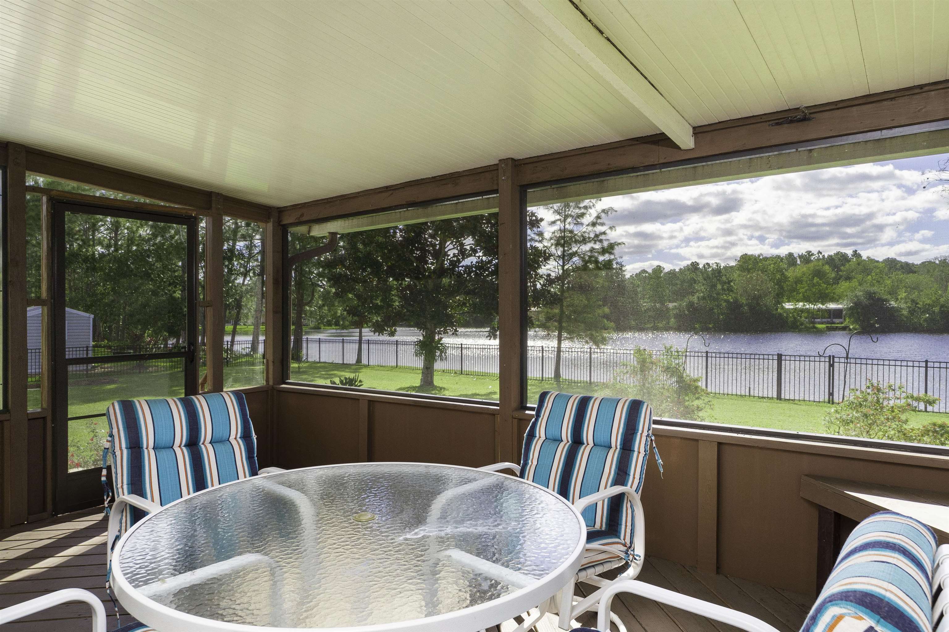 2232 Whippoorwill Drive St. Augustine, FL 32084 - Photo 2 of 51 a view of a chair and table in balcony