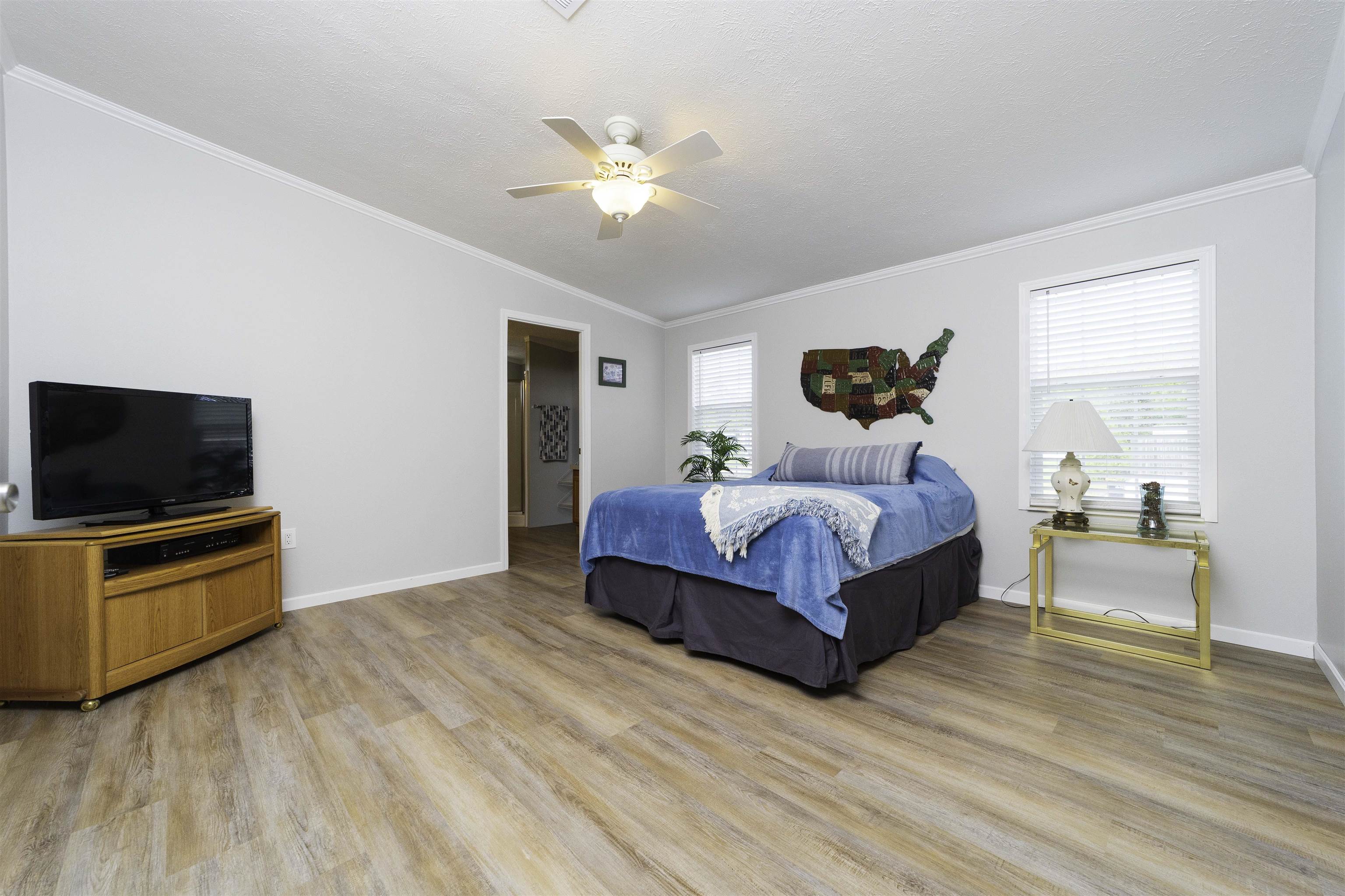2232 Whippoorwill Drive St. Augustine, FL 32084 - Photo 22 of 51 a bedroom with a bed and a flat screen tv