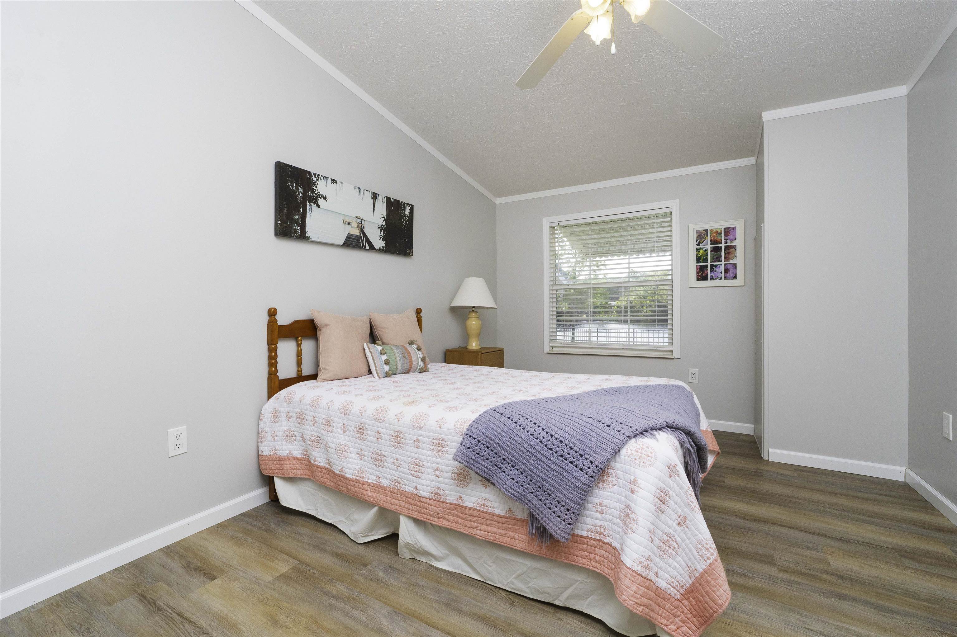 2232 Whippoorwill Drive St. Augustine, FL 32084 - Photo 27 of 51 a bedroom with a bed and a window