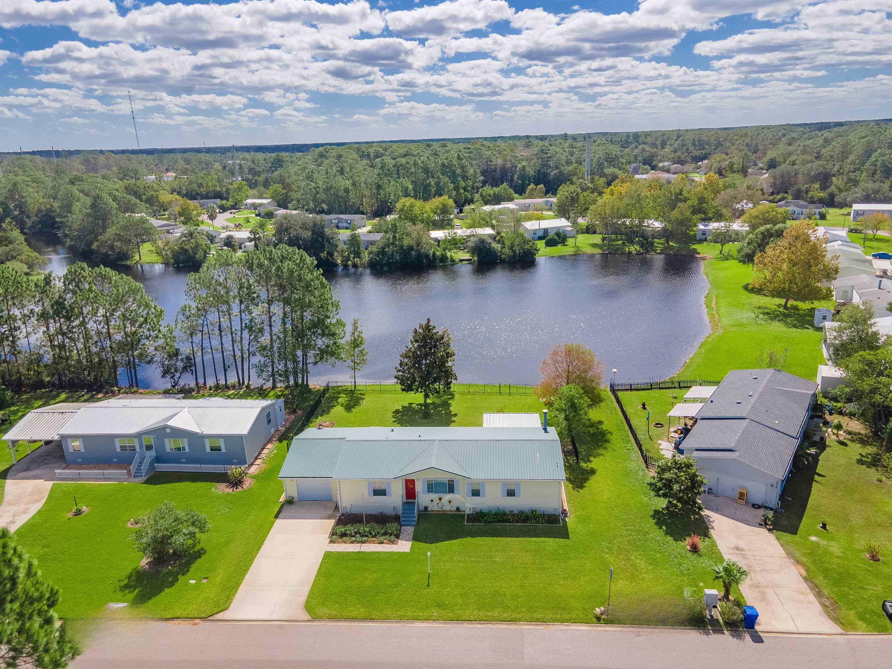 2232 Whippoorwill Drive St. Augustine, FL 32084 - Photo 3 of 51 an aerial view of a house with a lake view