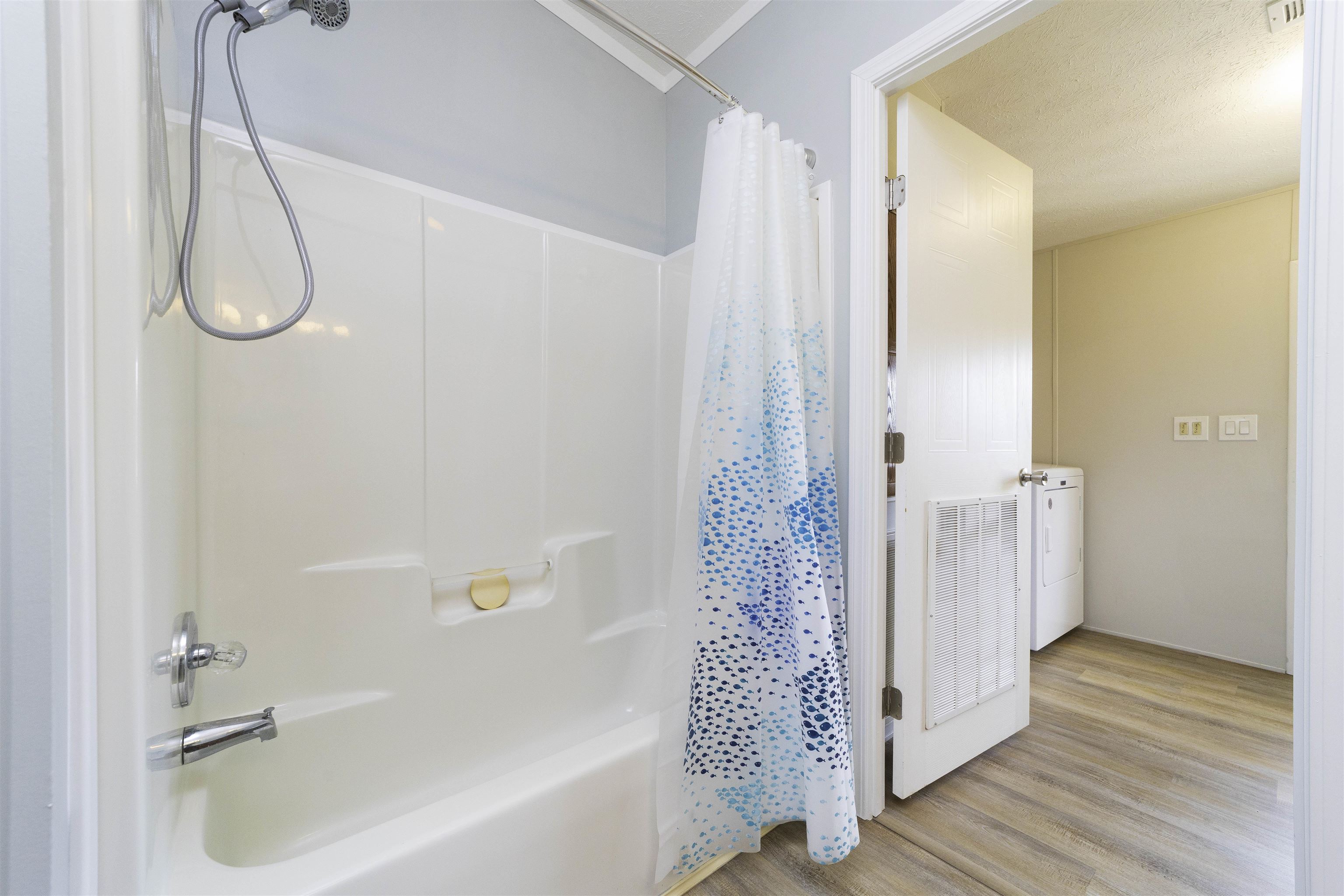 2232 Whippoorwill Drive St. Augustine, FL 32084 - Photo 31 of 51 a bathroom with a bathtub a shower and a sink