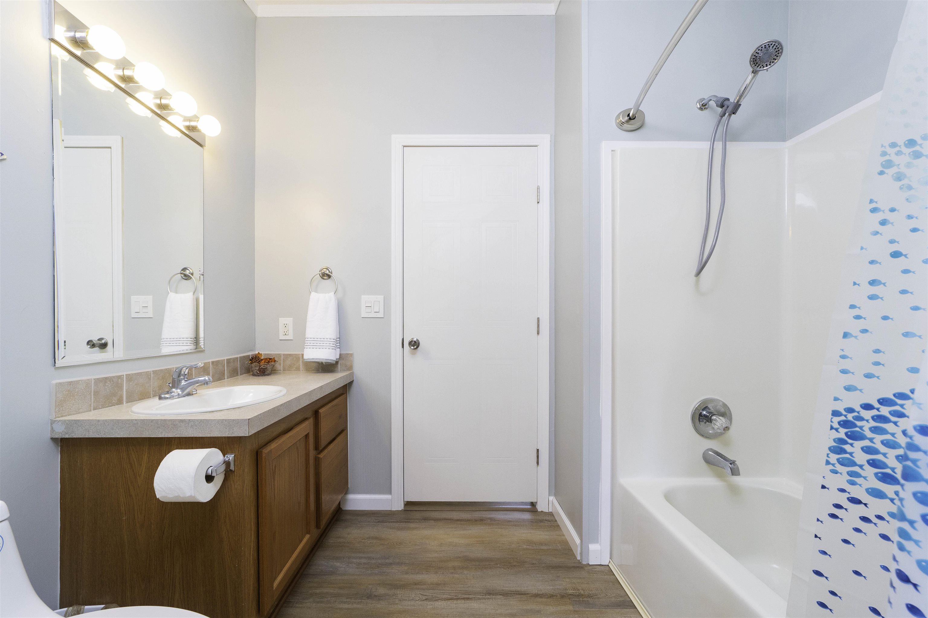 2232 Whippoorwill Drive St. Augustine, FL 32084 - Photo 33 of 51 a bathroom with a sink a mirror a bathtub and shower