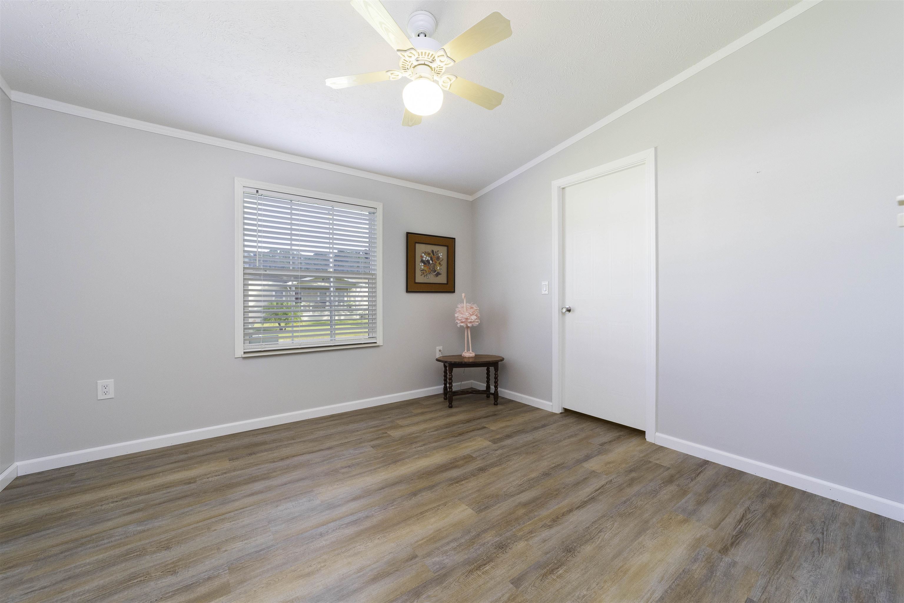 2232 Whippoorwill Drive St. Augustine, FL 32084 - Photo 35 of 51 wooden floor in an empty room with a window