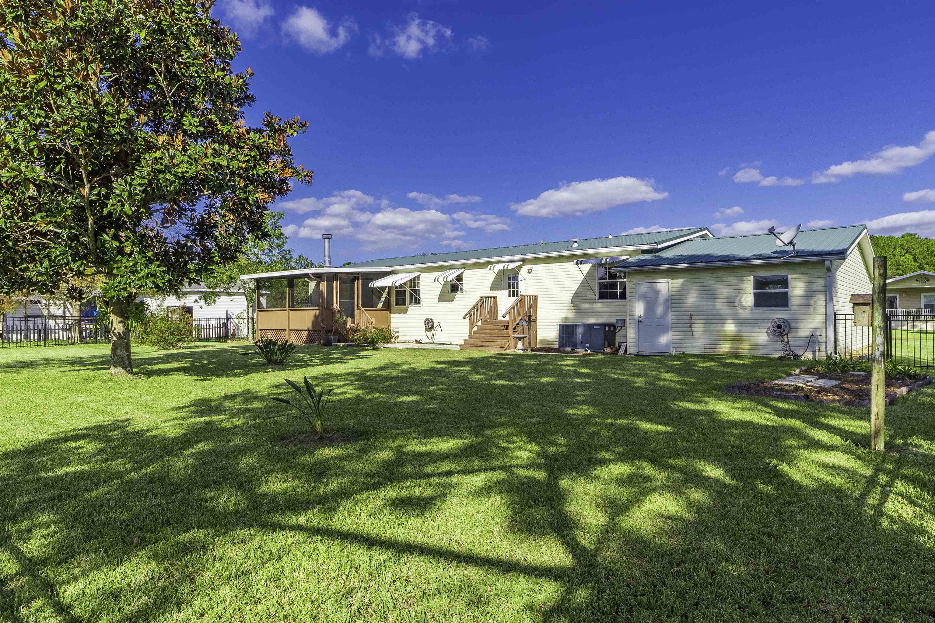 2232 Whippoorwill Drive St. Augustine, FL 32084 - Photo 44 of 51 a view of a house with a yard