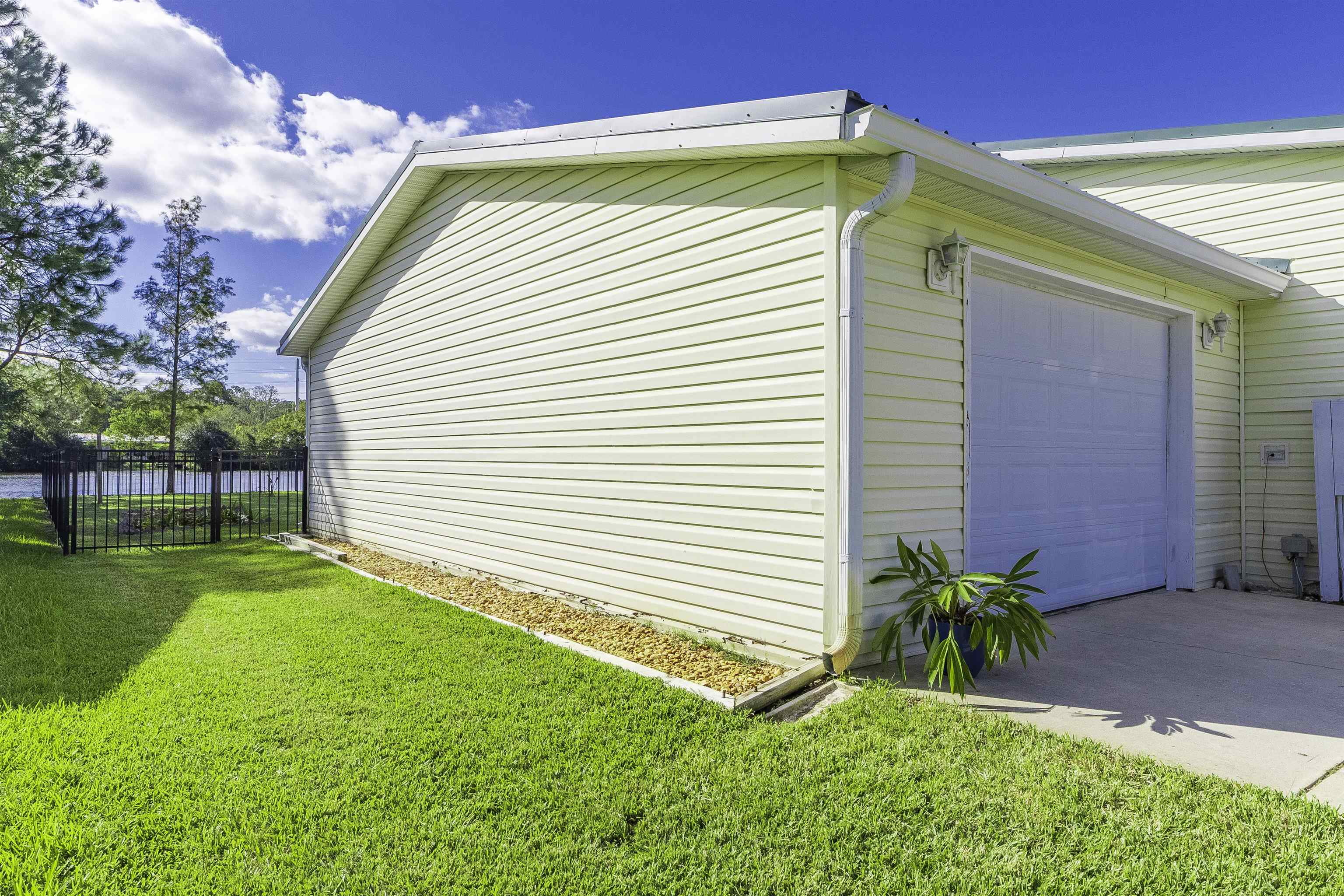 2232 Whippoorwill Drive St. Augustine, FL 32084 - Photo 50 of 51 a front view of a house with a yard