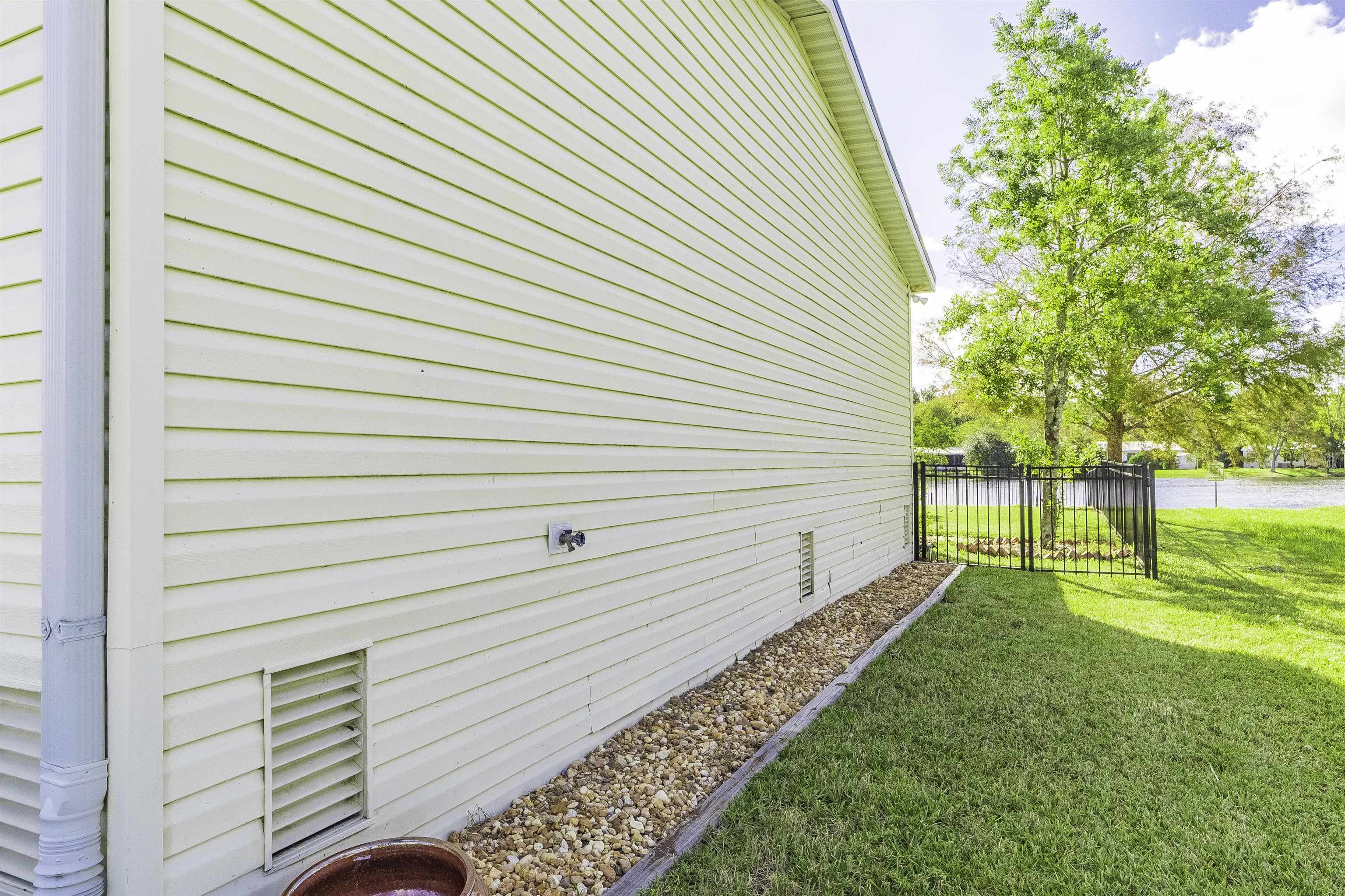 2232 Whippoorwill Drive St. Augustine, FL 32084 - Photo 51 of 51 a view of a backyard with wooden fence