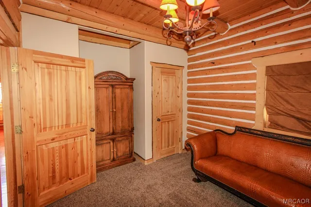 a bathroom with a sink a vanity and a large mirror