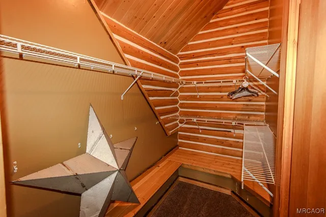 a bathroom with a granite countertop sink and a large mirror