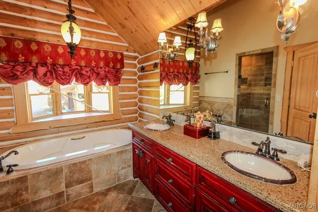 a bathroom with a bathtub and a shower