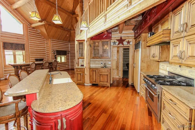 a view of a kitchen with chair and stove