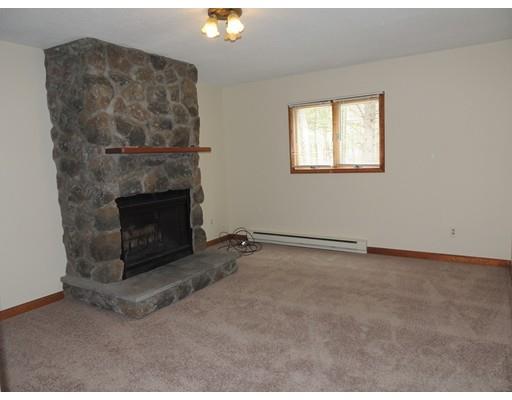 22 May Hill Road Monson, MA 01057 - Photo 6 of 25 an empty room with a fireplace