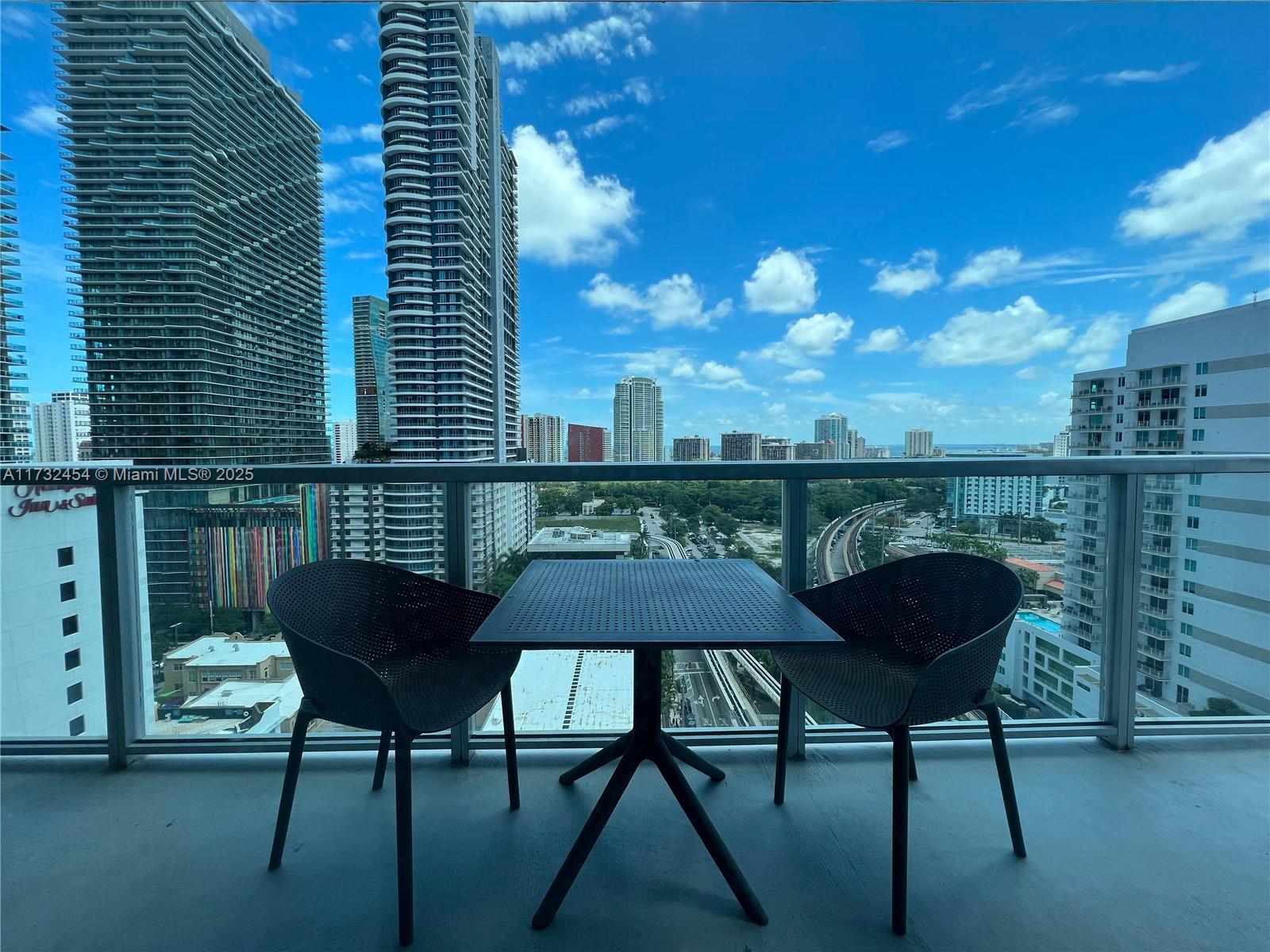 a view of a chairs and table in the patio