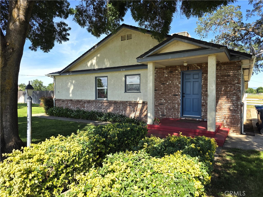 a front view of a house with garden