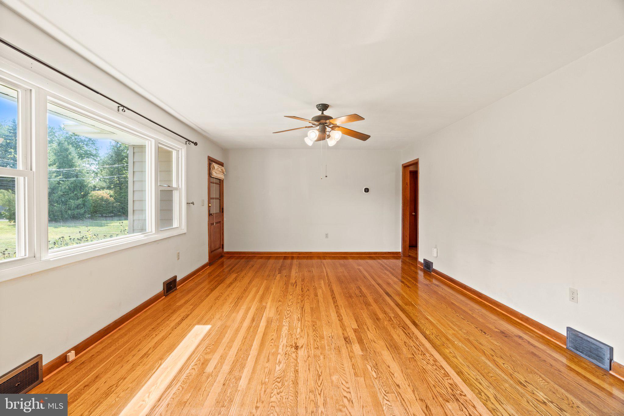 281 Pennington - Harbourton Road Pennington, NJ 08534 - Photo 11 of 35 a view of an empty room with wooden floor and a window