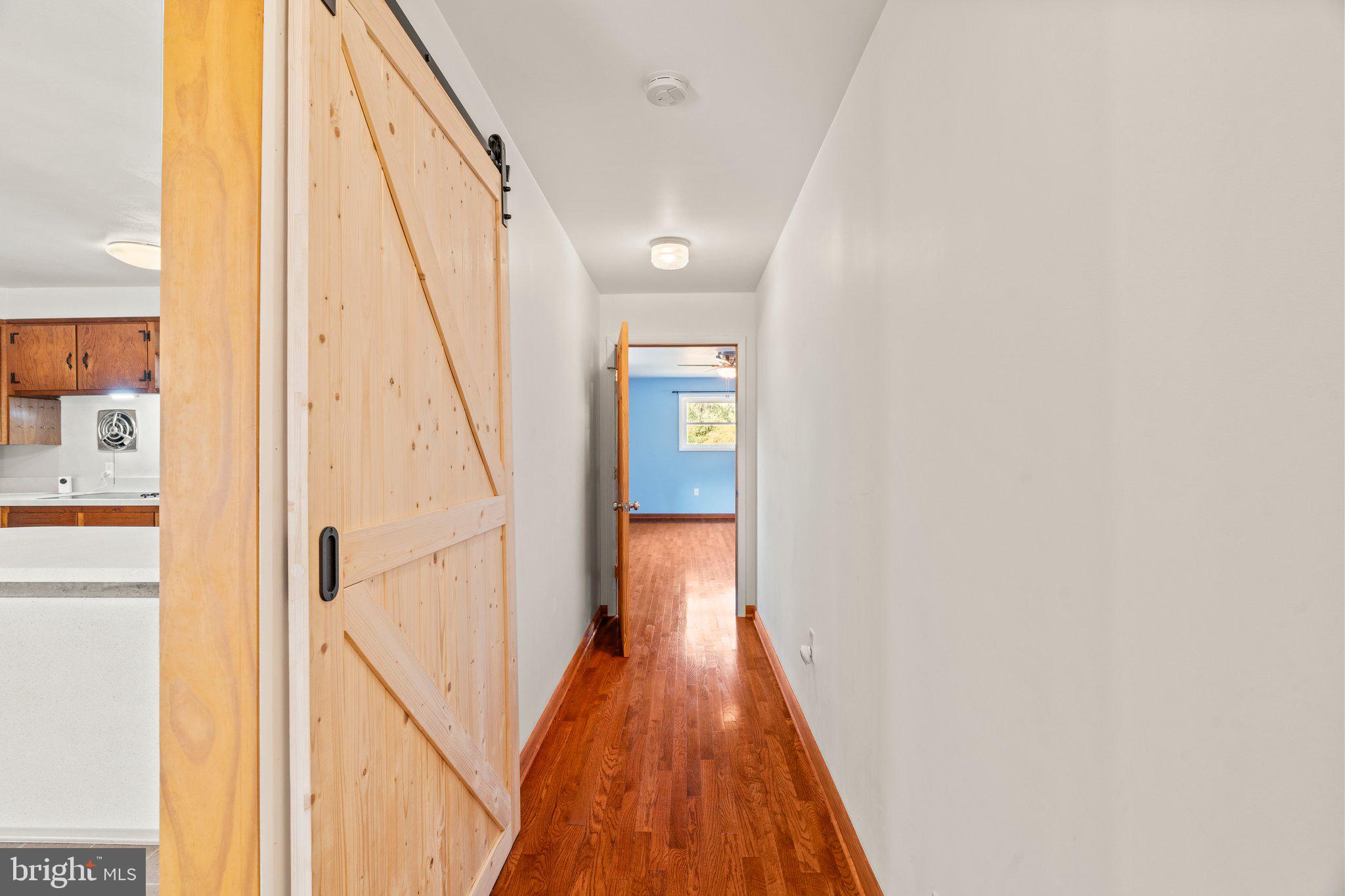 281 Pennington - Harbourton Road Pennington, NJ 08534 - Photo 12 of 35 a view of a hallway with wooden floor and staircase