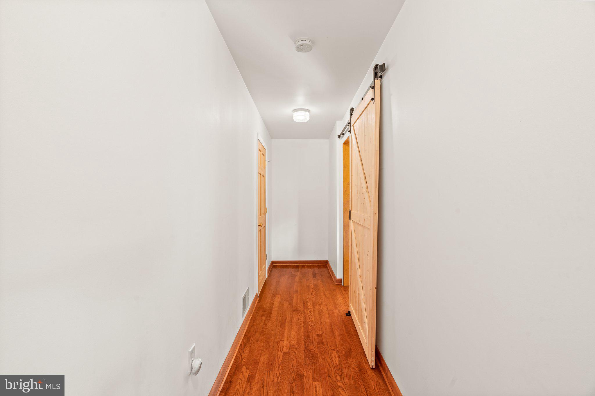 281 Pennington - Harbourton Road Pennington, NJ 08534 - Photo 19 of 35 a view of a hallway with wooden floor