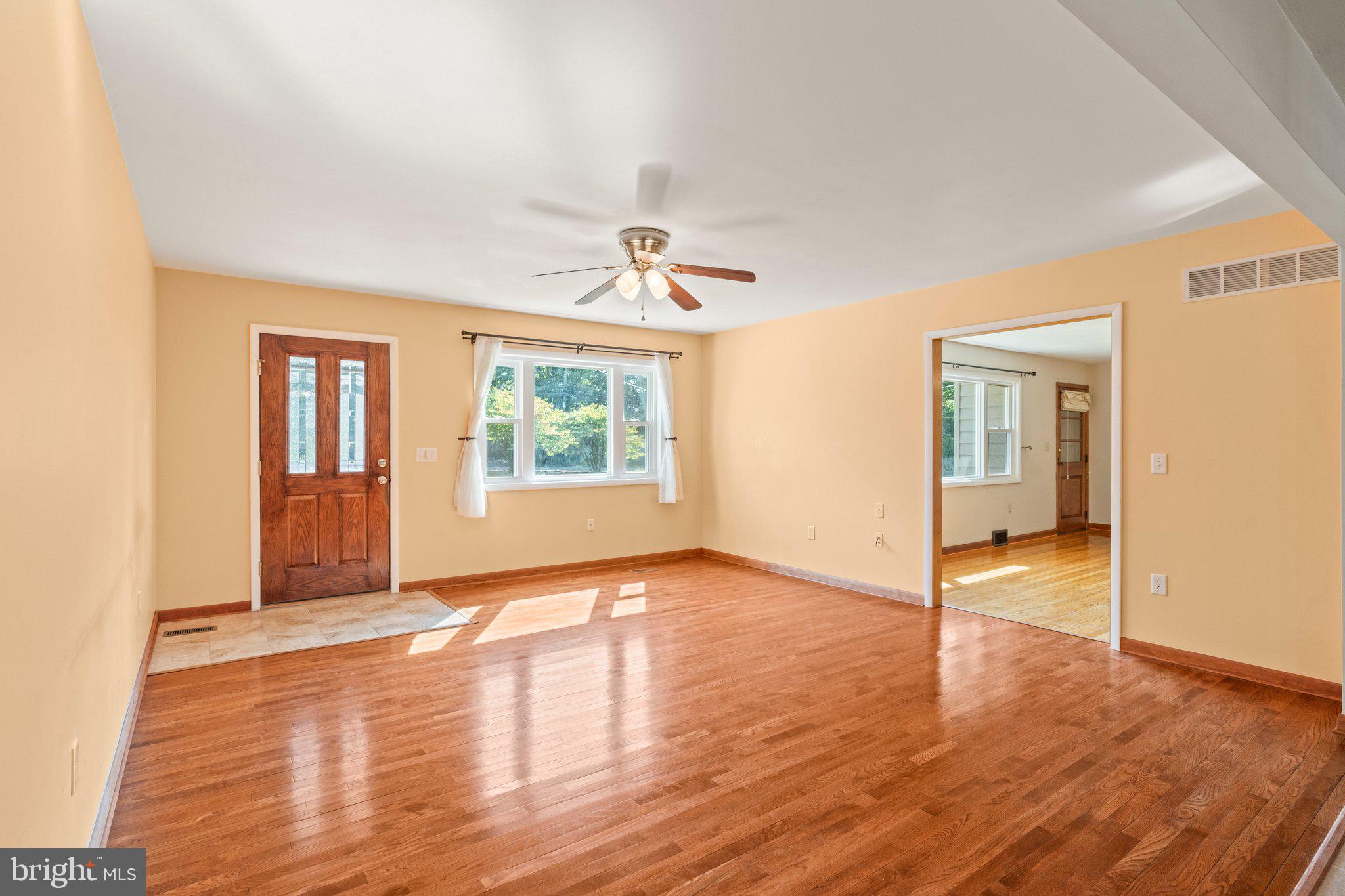 281 Pennington - Harbourton Road Pennington, NJ 08534 - Photo 5 of 35 an empty room with wooden floor and windows