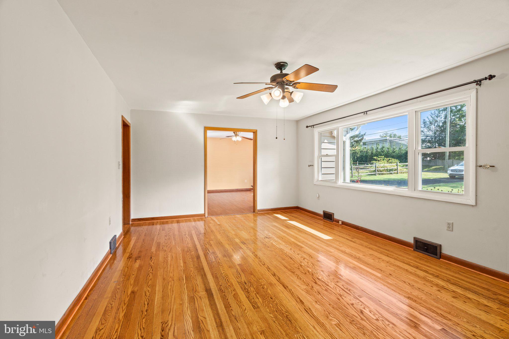 281 Pennington - Harbourton Road Pennington, NJ 08534 - Photo 10 of 35 a view of an empty room with a window and wooden floor