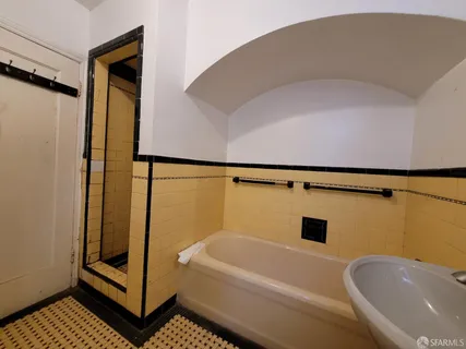 a bathroom with a bathtub and shower