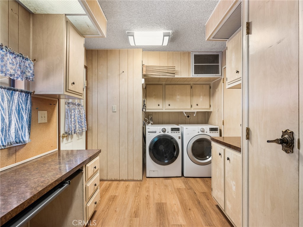 599 Smoke Tree Road Pinon Hills, CA 92372 - Photo 12 of 34 a view of a kitchen with a sink and a refrigerator