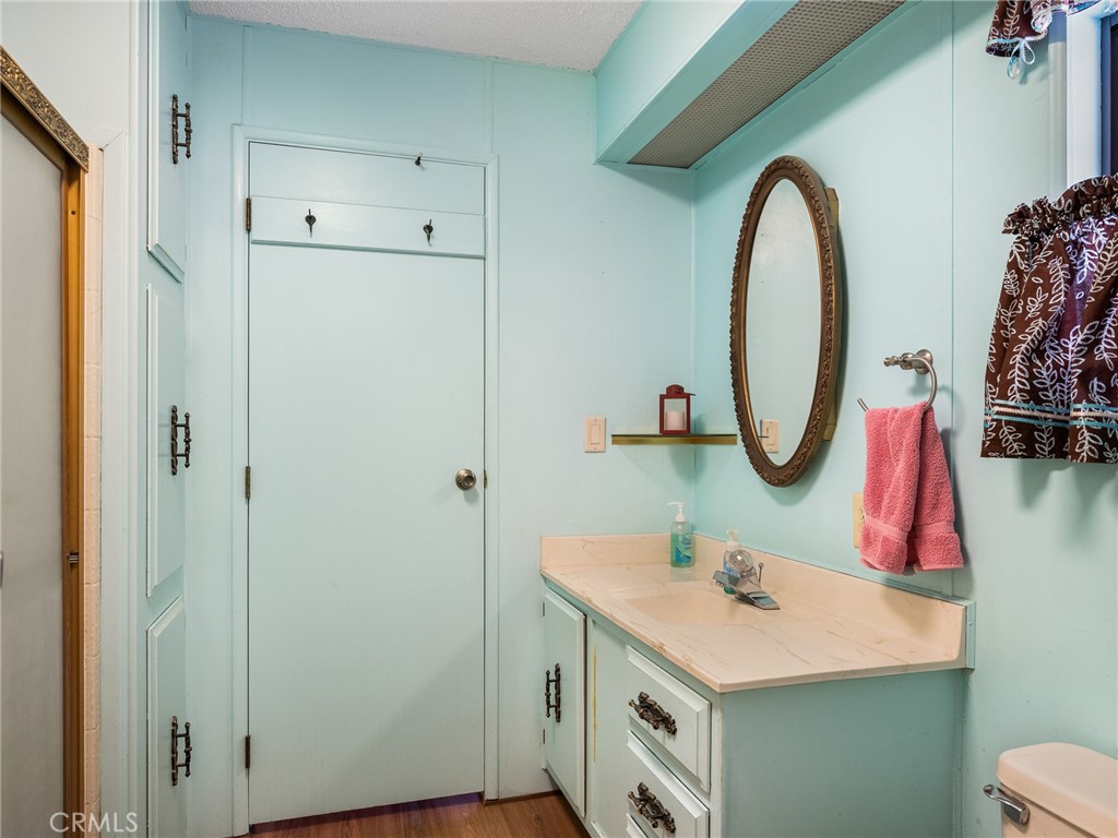 599 Smoke Tree Road Pinon Hills, CA 92372 - Photo 13 of 34 a bathroom with a sink and a mirror