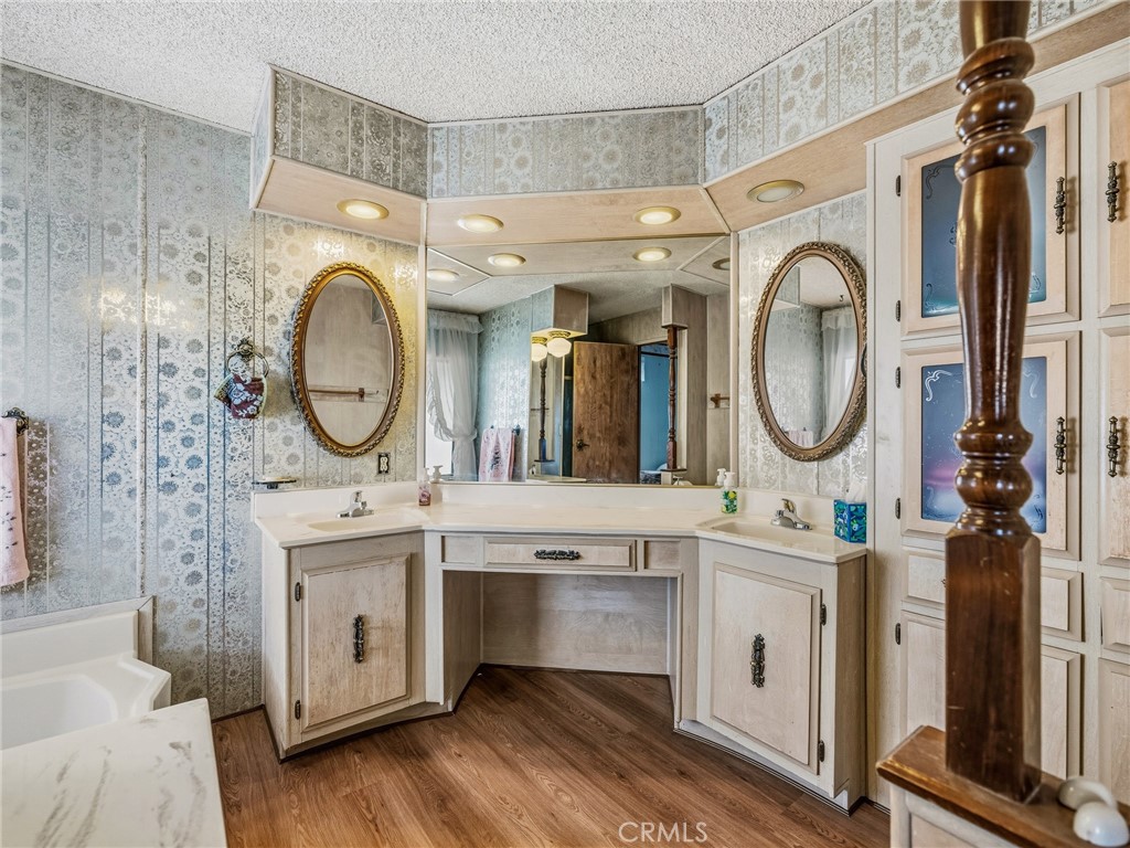 599 Smoke Tree Road Pinon Hills, CA 92372 - Photo 19 of 34 a bathroom with a toilet a sink and a mirror