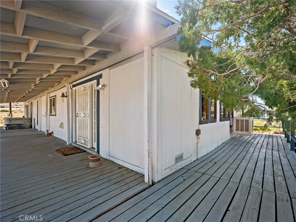 599 Smoke Tree Road Pinon Hills, CA 92372 - Photo 20 of 34 a view of a house with wooden floor