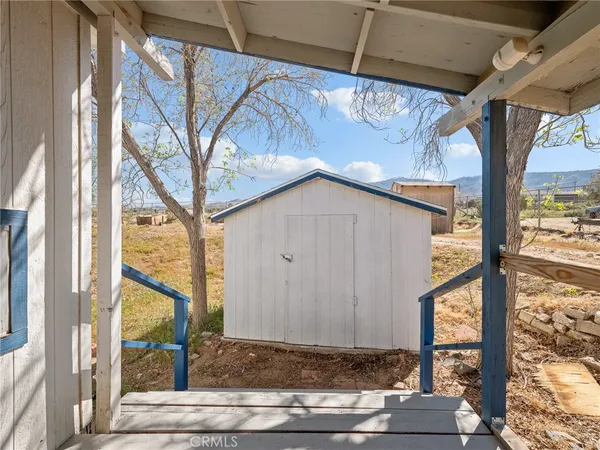 a view of a porch with a floor to ceiling window