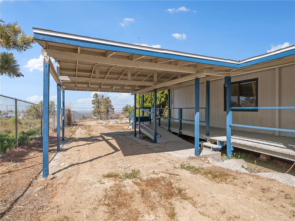 599 Smoke Tree Road Pinon Hills, CA 92372 - Photo 26 of 34 a view of a garage with wooden floor