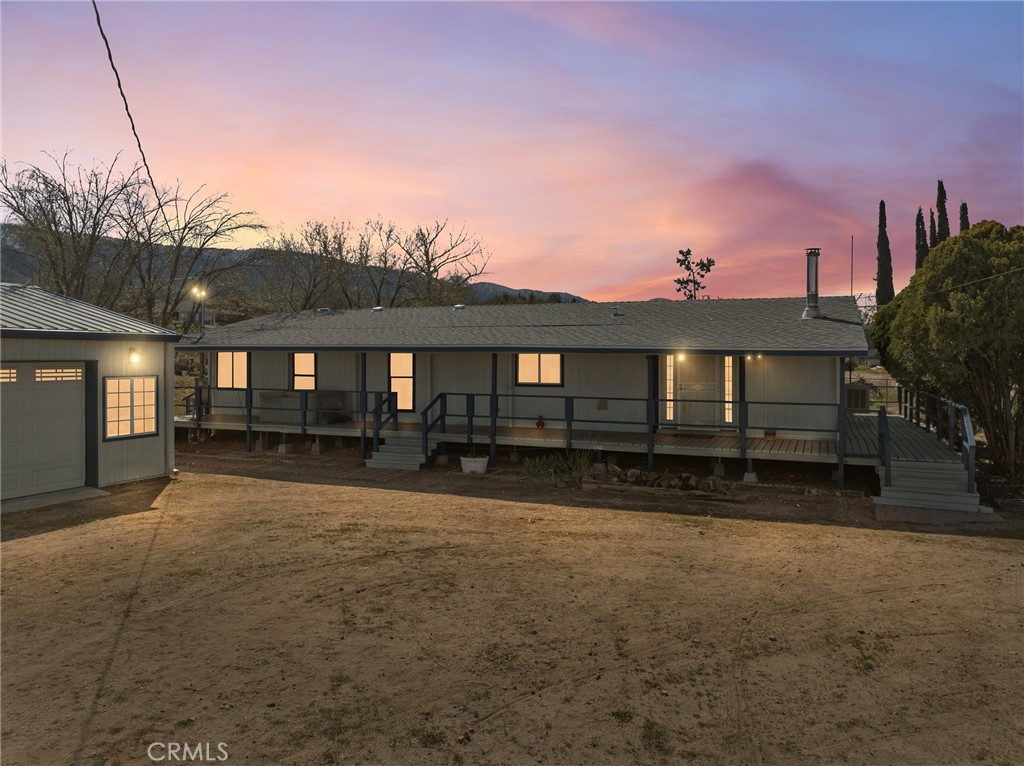 599 Smoke Tree Road Pinon Hills, CA 92372 - Photo 27 of 34 a front view of a house with a yard