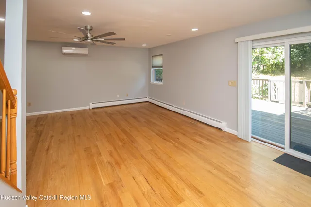 an empty room with a empty space and windows