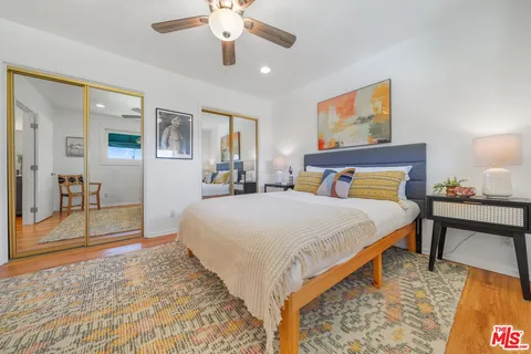 a bed room with a bed and a chandelier