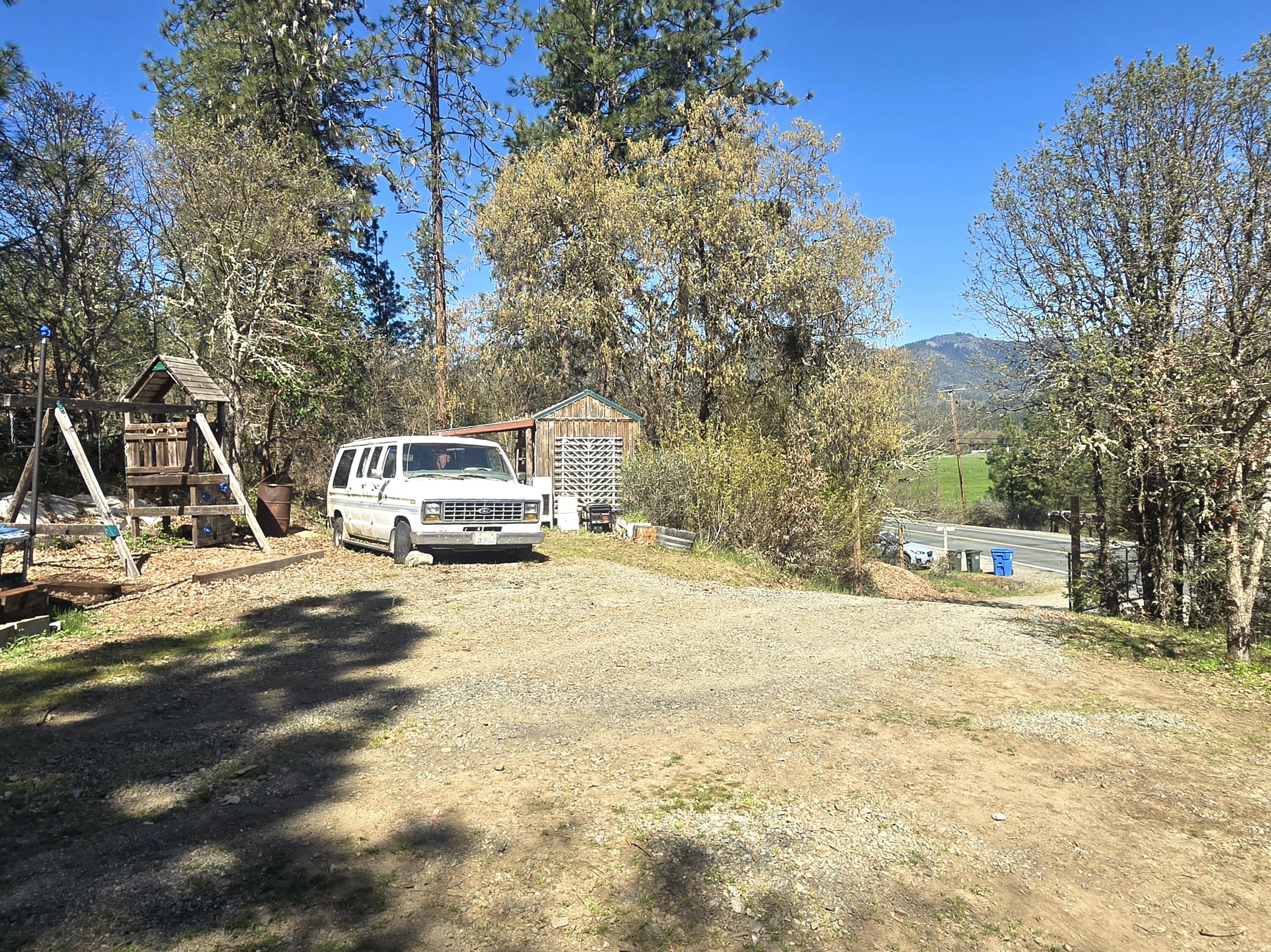 12726 Water Gap Road Williams, OR 97544 - Photo 37 of 47 a house with trees in front of it