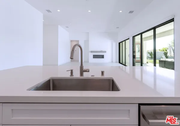 a bathroom with a sink and cabinets
